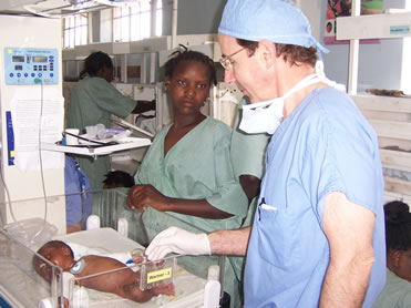 Dr. Sullivan with baby and mother after cleft surgery