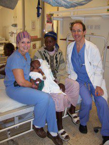 Dr. Sullivan meets with local woman to asses her infant born with cleft lip and palate. 