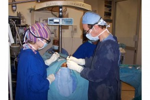 Dr. Sullivan skillfully operating on infant born with cleft lip and palate in Kenyan operating room. 